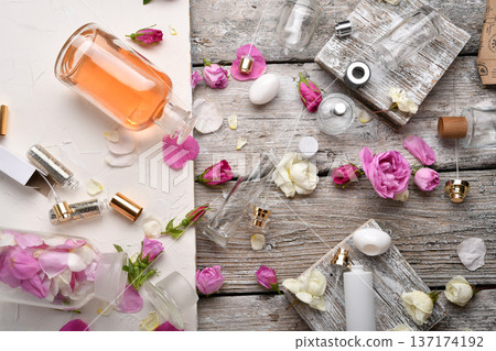 perfume empty bottles and essence  around roses settled at authentic provence background. Perfumer, beauty and trendy concept.  flat lay 137174192