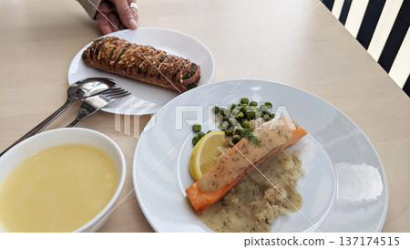 Sautéed salmon on a bright dining table Sautéed salmon on a bright dining table 137174515
