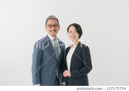 men and women wearing suits men and women wearing suits 137175754