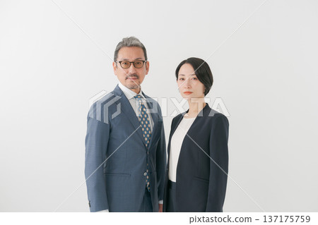 men and women wearing suits men and women wearing suits 137175759