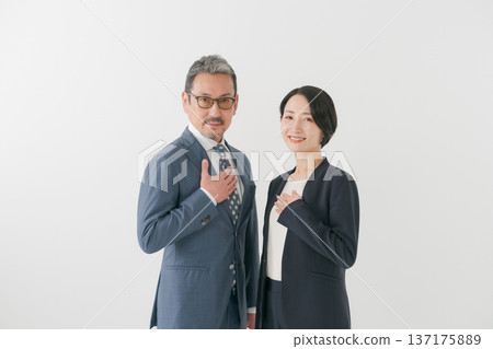 men and women wearing suits 137175889