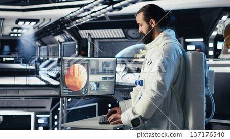 Astronaut looking at planet visualization before stepping out for scheduled operations outside space station. Cosmonaut in spacecraft powered by advanced engineering landing on planet Astronaut looking at planet visualization before stepping out for scheduled operations outside space station. Cosmonaut in spacecraft powered by advanced engineering landing on planet 137176540