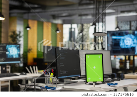 Isolated screen tablet on startup office desk showing deep learning programming languages written by developers. Mockup device in artificial intelligence company workspace used for code testing 137176616