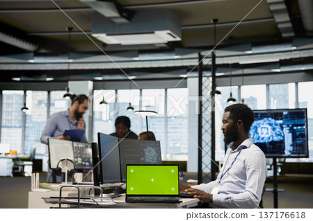 Engineer in office using AI automation scripts on isolated screen laptop to reduce repetitive coding tasks. IT professional using artificial intelligence technology on mockup notebook Engineer in office using AI automation scripts on isolated screen laptop to reduce repetitive coding tasks. IT professional using artificial intelligence technology on mockup notebook 137176618