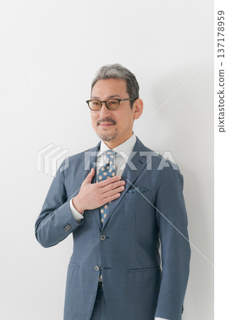 Businessman hitting his chest Businessman hitting his chest 137178959