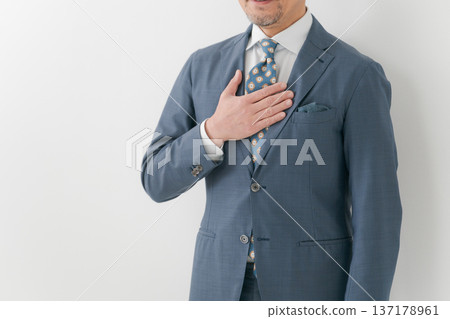 Businessman hitting his chest Businessman hitting his chest 137178961