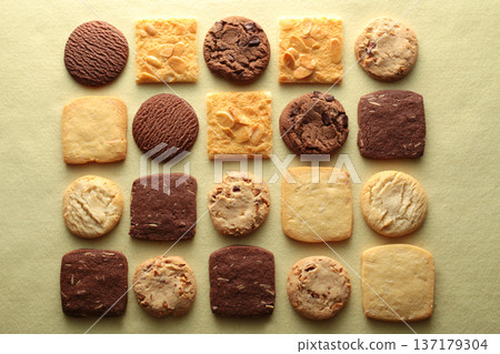 A group photo of cookies taken from above with a warm color background 137179304