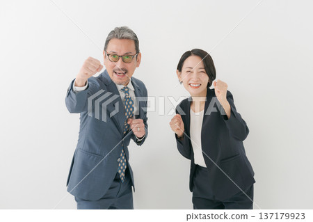 Men and women in suits cheering Men and women in suits cheering 137179923
