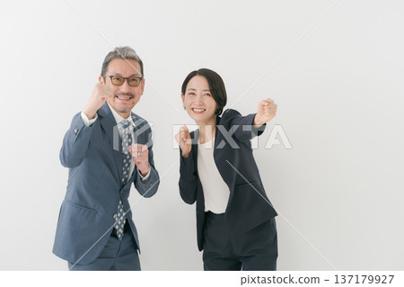 Men and women in suits cheering Men and women in suits cheering 137179927