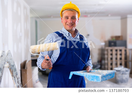 Portrait of smiling man painter in apartment Portrait of smiling man painter in apartment 137180703