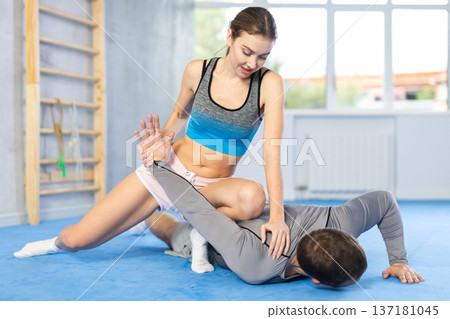 Woman and man practicing self defense techniques 137181045