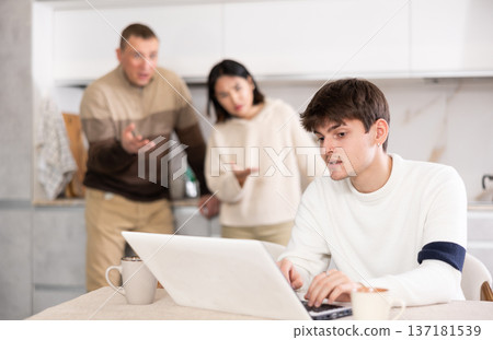 Disgruntled relatives of young man scold him for his passion for computer games Disgruntled relatives of young man scold him for his passion for computer games 137181539