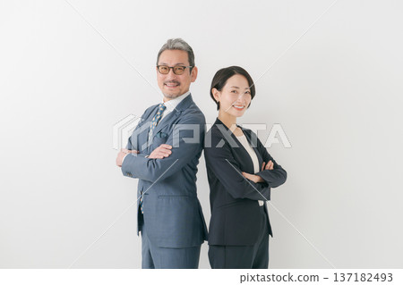 Two businessmen with their arms folded 137182493