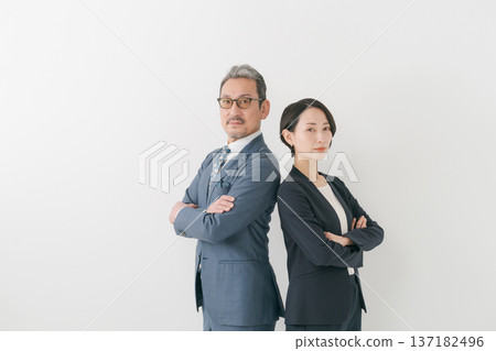 Two businessmen with their arms folded 137182496