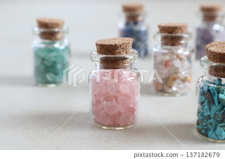 Colorful natural stones in a bottle Colorful natural stones in a bottle 137182679