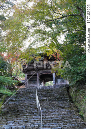 Tower gate and stone steps of Takao Jingoji Temple in Kyoto Tower gate and stone steps of Takao Jingoji Temple in Kyoto 137182903
