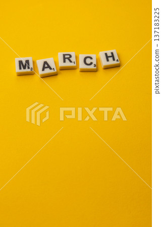 Celebrating National Scrabble Day with letter tiles spelling March 137183225