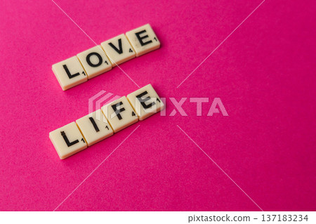 Celebrate National Scrabble Day with letters forming love and life Celebrate National Scrabble Day with letters forming love and life 137183234