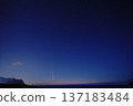 Comet shining in the night sky 137183484