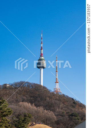 N Seoul Tower with autumn landscape. It is also known as Namsan Tower or Seoul Tower, the landmark which is a communication and observation tower located on Nam Mountain in central Seoul, South Korea N Seoul Tower with autumn landscape. It is also known as Namsan Tower or Seoul Tower, the landmark which is a communication and observation tower located on Nam Mountain in central Seoul, South Korea 137183937