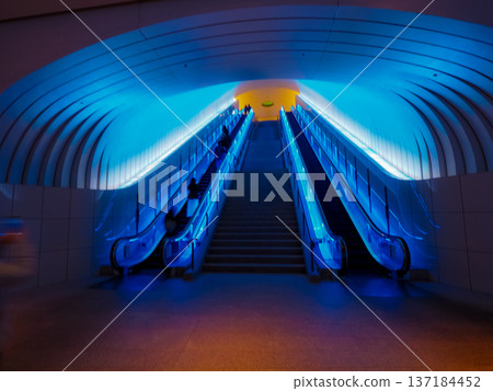 A mysterious escalator hall that glows blue A mysterious escalator hall that glows blue 137184452