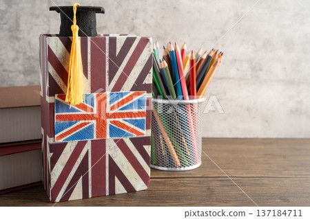 UK flag with graduate hat on english language book. 137184711