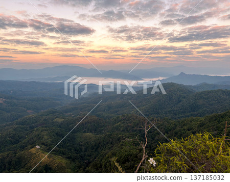 Spectacular sunrise over a mountain range with a sea of mist and colorful clouds. Spectacular sunrise over a mountain range with a sea of mist and colorful clouds. 137185032