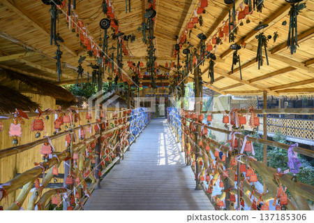 Wooden gallery with amulets and wishes written on plaques in Hainan in China Wooden gallery with amulets and wishes written on plaques in Hainan in China 137185306