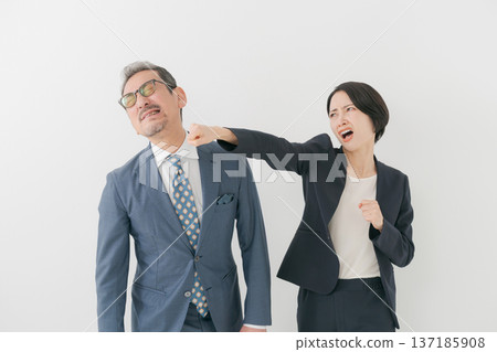 Middle-aged man being punched 137185908