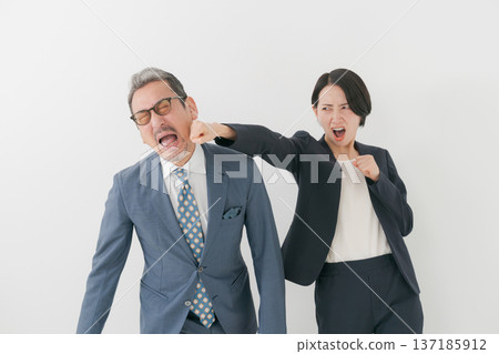 Middle-aged man being punched 137185912