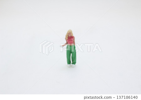 Miniature Figure Stands Wearing Bright Two Tone Outfit Colors 137186140