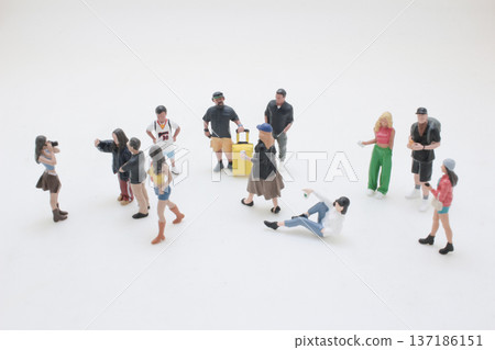 Miniature Figures Spread Out Engaging In Varied Poses Miniature Figures Spread Out Engaging In Varied Poses 137186151