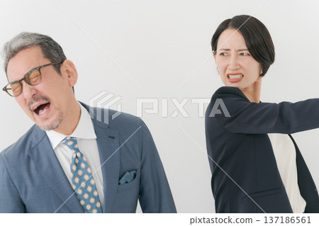 Middle-aged man being punched 137186561