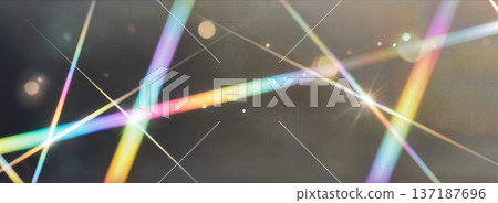 Abstract background with colorful light beams and lens flares crossing each other creating geometric patterns on dark surface for design projects 137187696