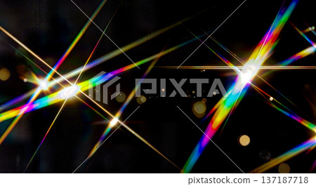 Abstract geometric background with crossing rainbow colored light beams and lens flares creating prismatic effect on black surface for design Abstract geometric background with crossing rainbow colored light beams and lens flares creating prismatic effect on black surface for design 137187718
