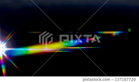 Abstract optical lens flare effect with bright white light beam splitting into colorful rainbow spectrum on black background for overlay or science concept Abstract optical lens flare effect with bright white light beam splitting into colorful rainbow spectrum on black background for overlay or science concept 137187720