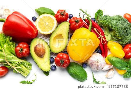 Fresh healthy eating ingredients arranged on white background 137187888