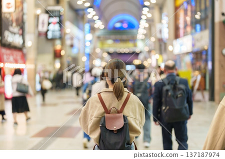 Woman tourist sightseeing Sendai shopping road. Happy traveler travel near Sendai station, Miyagi Prefecture, Japan. Famous Landmark and Vacation Woman tourist sightseeing Sendai shopping road. Happy traveler travel near Sendai station, Miyagi Prefecture, Japan. Famous Landmark and Vacation 137187974