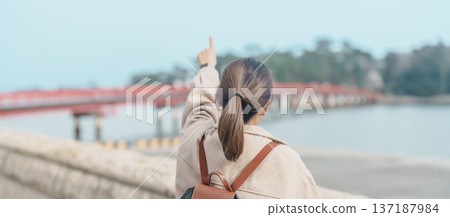 Woman tourist sightseeing Fukuura jima bridge or the bridge of romantic encounters for Fukuura Island at Matsushima Bay in Matsushima, Miyagi Prefecture, Tohoku, Japan. Landmark and famous Vacation Woman tourist sightseeing Fukuura jima bridge or the bridge of romantic encounters for Fukuura Island at Matsushima Bay in Matsushima, Miyagi Prefecture, Tohoku, Japan. Landmark and famous Vacation 137187984