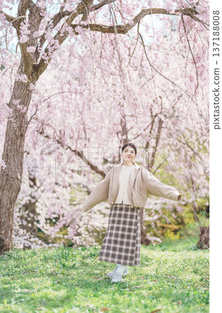 Woman tourist sightseeing Sakura Cherry Blossom in Spring, happy traveler travel in Tendo Park or Maizuru Park in Yamagata prefecture, Tohoku, Japan. famous Landmark for Travel and Vacation Woman tourist sightseeing Sakura Cherry Blossom in Spring, happy traveler travel in Tendo Park or Maizuru Park in Yamagata prefecture, Tohoku, Japan. famous Landmark for Travel and Vacation 137188008