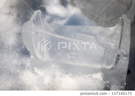 Large Ice Chunks Resting Outdoors On Snow Covered Ground Large Ice Chunks Resting Outdoors On Snow Covered Ground 137188173