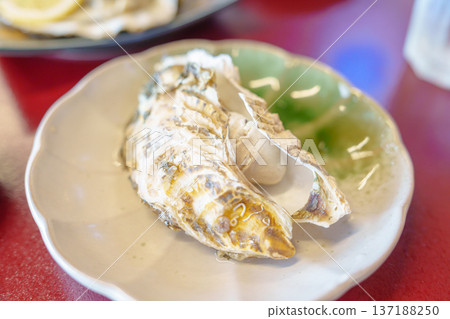 grilled Oyster in Matsushima fish market, seafood famous and popular of Matsushima bay in Miyagi Prefecture, Tohoku, Japan grilled Oyster in Matsushima fish market, seafood famous and popular of Matsushima bay in Miyagi Prefecture, Tohoku, Japan 137188250