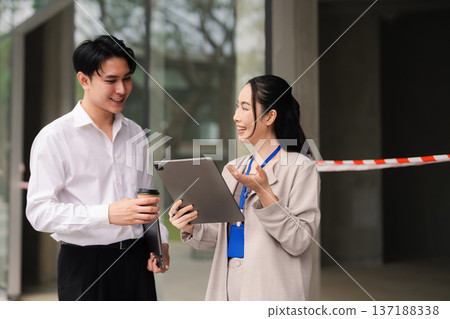 business team walking outside the office, discussing projects and strategy with partners. teamwork, collaboration, and corporate success. business team walking outside the office, discussing projects and strategy with partners. teamwork, collaboration, and corporate success. 137188338