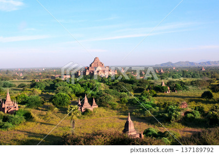 Aerial view on temples in the Archaeological Zone, Bagan, Myanmar. Top view on ancient stupas in old city of Pagan, Burma. Topic of vacation, travel, trip abroad on vacation, cruises and tours 137189792