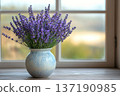 Bouquet of Bright Lavender in a Vase on a Windowsill 137190985