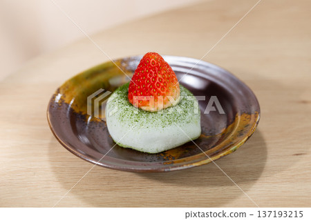Matcha Green Tea Mochi with Fresh Strawberry Topping on Ceramic Plate 137193215