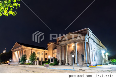 Galloway Memorial United Methodist Church is located in Jackson, Mississippi, USA. Historic Neoclassical architecture features the illuminated portico and massive stone columns under a dark night sky Galloway Memorial United Methodist Church is located in Jackson, Mississippi, USA. Historic Neoclassical architecture features the illuminated portico and massive stone columns under a dark night sky 137193312