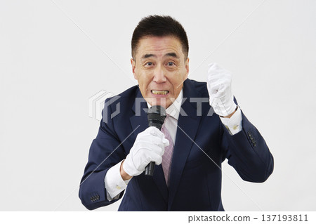 A candidate giving a passionate speech against a white background 137193811