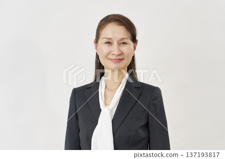 Smiling career woman portrait on white background 137193817