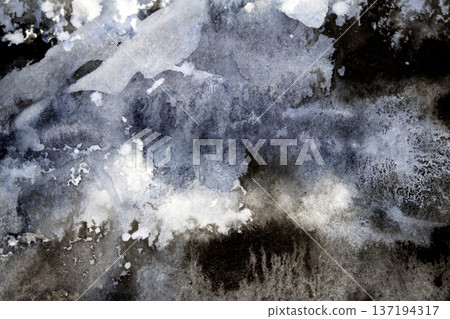 Abstract black and grey watercolour paint and ink swirling on white paper background to look like clouds and monochrome wash 137194317